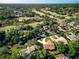 Scenic aerial perspective of the home near a golf course, blending community and recreation at 257 Sweet Bay Dr, New Smyrna Beach, FL 32168