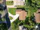 Captivating aerial view of the home showcasing the manicured lawn and mature trees at 257 Sweet Bay Dr, New Smyrna Beach, FL 32168