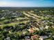 Overhead shot of home in golf community with mature trees and picturesque surroundings at 257 Sweet Bay Dr, New Smyrna Beach, FL 32168