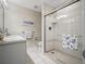 Bright bathroom featuring a glass shower, ceramic tiled floor, and a modern vanity at 257 Sweet Bay Dr, New Smyrna Beach, FL 32168