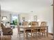 Dining area with hardwood floors and a view of the backyard from the windows at 257 Sweet Bay Dr, New Smyrna Beach, FL 32168