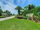 Welcoming entrance to the community with lush landscaping and a clear view of the signage at 257 Sweet Bay Dr, New Smyrna Beach, FL 32168