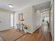Inviting foyer featuring wood floors, a decorative table, and a bright, welcoming atmosphere at 257 Sweet Bay Dr, New Smyrna Beach, FL 32168