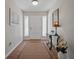 Bright foyer with a glass table and stylish decor that offers a welcoming entrance to your home at 257 Sweet Bay Dr, New Smyrna Beach, FL 32168