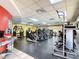 Bright and spacious gym featuring modern exercise equipment, black rubber flooring, and fluorescent lighting at 257 Sweet Bay Dr, New Smyrna Beach, FL 32168