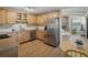 Spacious kitchen with wooden cabinets, stainless steel appliances, and a breakfast nook at 257 Sweet Bay Dr, New Smyrna Beach, FL 32168
