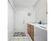 Well-lit laundry room with white appliances, storage, and convenient access to the exterior at 257 Sweet Bay Dr, New Smyrna Beach, FL 32168