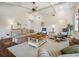 Bright living room featuring vaulted ceilings with beams and plush, comfortable furniture at 257 Sweet Bay Dr, New Smyrna Beach, FL 32168