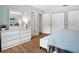 Main bedroom with wood floors, double closets, and a view of the connecting bathroom at 257 Sweet Bay Dr, New Smyrna Beach, FL 32168