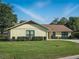 Well-maintained backyard with healthy green grass and pruned shrubbery, offering a serene outdoor space at 257 Sweet Bay Dr, New Smyrna Beach, FL 32168