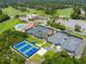 Community tennis courts including hard and clay surfaces, along with a community pool at 257 Sweet Bay Dr, New Smyrna Beach, FL 32168