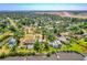 Aerial view of the property with proximity to the coast and nearby airport at 2576 Sunset Dr, New Smyrna Beach, FL 32168