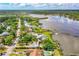 Aerial view of the property with waterfront views and neighborhood at 2576 Sunset Dr, New Smyrna Beach, FL 32168