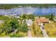 Aerial view of the property with water views and a well-maintained exterior at 2576 Sunset Dr, New Smyrna Beach, FL 32168