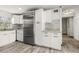 Modern kitchen featuring stainless steel appliances, stylish backsplash, and ample cabinet space at 2576 Sunset Dr, New Smyrna Beach, FL 32168