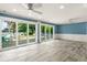 Open-concept living room with sliding glass doors leading to the outdoor patio and waterfront views at 2576 Sunset Dr, New Smyrna Beach, FL 32168