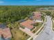 Stunning aerial view of the property showcasing the tile roof, manicured lawns, and neighborhood at 260 Portofino Blvd, New Smyrna Beach, FL 32168