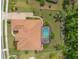 Overhead aerial view featuring a private backyard pool, tile roof, and meticulous landscaping at 260 Portofino Blvd, New Smyrna Beach, FL 32168