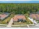 Gorgeous aerial view highlights the home's prime location, meticulous landscaping, and tile roofing at 260 Portofino Blvd, New Smyrna Beach, FL 32168