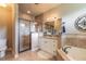 Beautiful main bathroom with a walk-in shower, soaking tub, and granite countertops at 260 Portofino Blvd, New Smyrna Beach, FL 32168