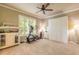 Bright bedroom with an exercise bike and an armoire for versatile living at 260 Portofino Blvd, New Smyrna Beach, FL 32168