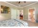 Bedroom featuring neutral walls, carpet and a view into the connected living room and bathroom at 260 Portofino Blvd, New Smyrna Beach, FL 32168
