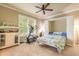 Versatile bedroom showcasing a murphy bed, exercise equipment and a wall of windows at 260 Portofino Blvd, New Smyrna Beach, FL 32168