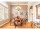 Elegant dining area with hardwood floors and a chandelier at 260 Portofino Blvd, New Smyrna Beach, FL 32168