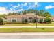 Charming single-story home featuring a barrel tile roof and well-manicured landscaping at 260 Portofino Blvd, New Smyrna Beach, FL 32168