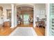 Elegant foyer with hardwood floors seamlessly transitioning to the living areas at 260 Portofino Blvd, New Smyrna Beach, FL 32168