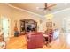 This living room boasts hardwood floors, entertainment center, and lots of natural light at 260 Portofino Blvd, New Smyrna Beach, FL 32168