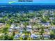 Stunning aerial view showcases the property nestled in a lush neighborhood, with a glimpse of the Atlantic Ocean at 2714 Yule Tree Dr, Edgewater, FL 32141