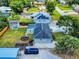 Aerial view showcases a large backyard, fenced perimeter, and detached building at 2714 Yule Tree Dr, Edgewater, FL 32141