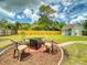 The backyard features an outdoor seating area with a table and chairs at 2714 Yule Tree Dr, Edgewater, FL 32141