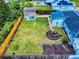 Beautiful backyard with a fire pit, privacy fence and landscaped garden at 2714 Yule Tree Dr, Edgewater, FL 32141