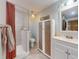 Charming bathroom with a glass-enclosed shower, linen cabinet, and a stylish vanity with ample storage space at 2714 Yule Tree Dr, Edgewater, FL 32141