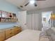 Bright bedroom featuring a modern ceiling fan, stylish closet doors, and light blue walls for a calming ambiance at 2714 Yule Tree Dr, Edgewater, FL 32141