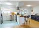Modern kitchen with stainless steel appliances, breakfast bar, and stylish flooring, creating a functional space at 2714 Yule Tree Dr, Edgewater, FL 32141