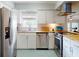 Well-lit kitchen featuring stainless steel appliances, butcher block countertops, and modern subway tile backsplash at 2714 Yule Tree Dr, Edgewater, FL 32141