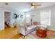 Bright living room with a comfortable sectional sofa, natural light, and hardwood flooring; a cozy and stylish space at 2714 Yule Tree Dr, Edgewater, FL 32141