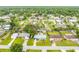 Aerial shot of home in a neighborhood with lush trees, grassy lawns, and mature landscaping at 2726 Victory Palm Dr, Edgewater, FL 32141