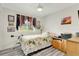 Comfortable bedroom featuring a telescope, hardwood-style flooring and soft natural light at 2726 Victory Palm Dr, Edgewater, FL 32141