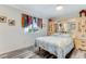 Bedroom featuring wood-look flooring, decorative touches and a large wardrobe with mirror at 2726 Victory Palm Dr, Edgewater, FL 32141