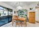 Bright dining room with a sliding glass door and a vintage turquoise hutch at 2726 Victory Palm Dr, Edgewater, FL 32141