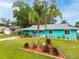 Charming single Gathering home featuring a manicured front yard, inviting curb appeal and a bright exterior paint scheme at 2726 Victory Palm Dr, Edgewater, FL 32141