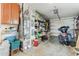 Spacious garage with ample shelving, storage cabinets, and parking for a motorcycle at 2726 Victory Palm Dr, Edgewater, FL 32141