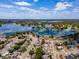 Beautiful aerial view of waterfront home with lake access and mature trees at 2802 English Dr, Deltona, FL 32738