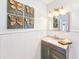 Stylish bathroom featuring a vanity, decorative wall art, and modern fixtures at 2802 English Dr, Deltona, FL 32738