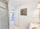 Tastefully decorated bathroom with beadboard accents and decorative butterfly wall art at 2802 English Dr, Deltona, FL 32738