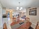 Inviting dining area with an open concept layout connecting the kitchen, dining, and living spaces at 2802 English Dr, Deltona, FL 32738